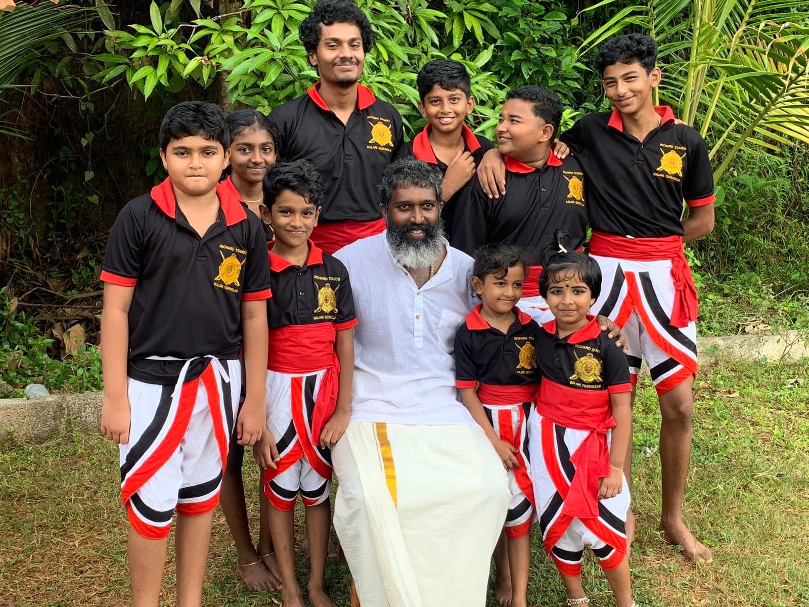 Students with their Gurukkal outdoors